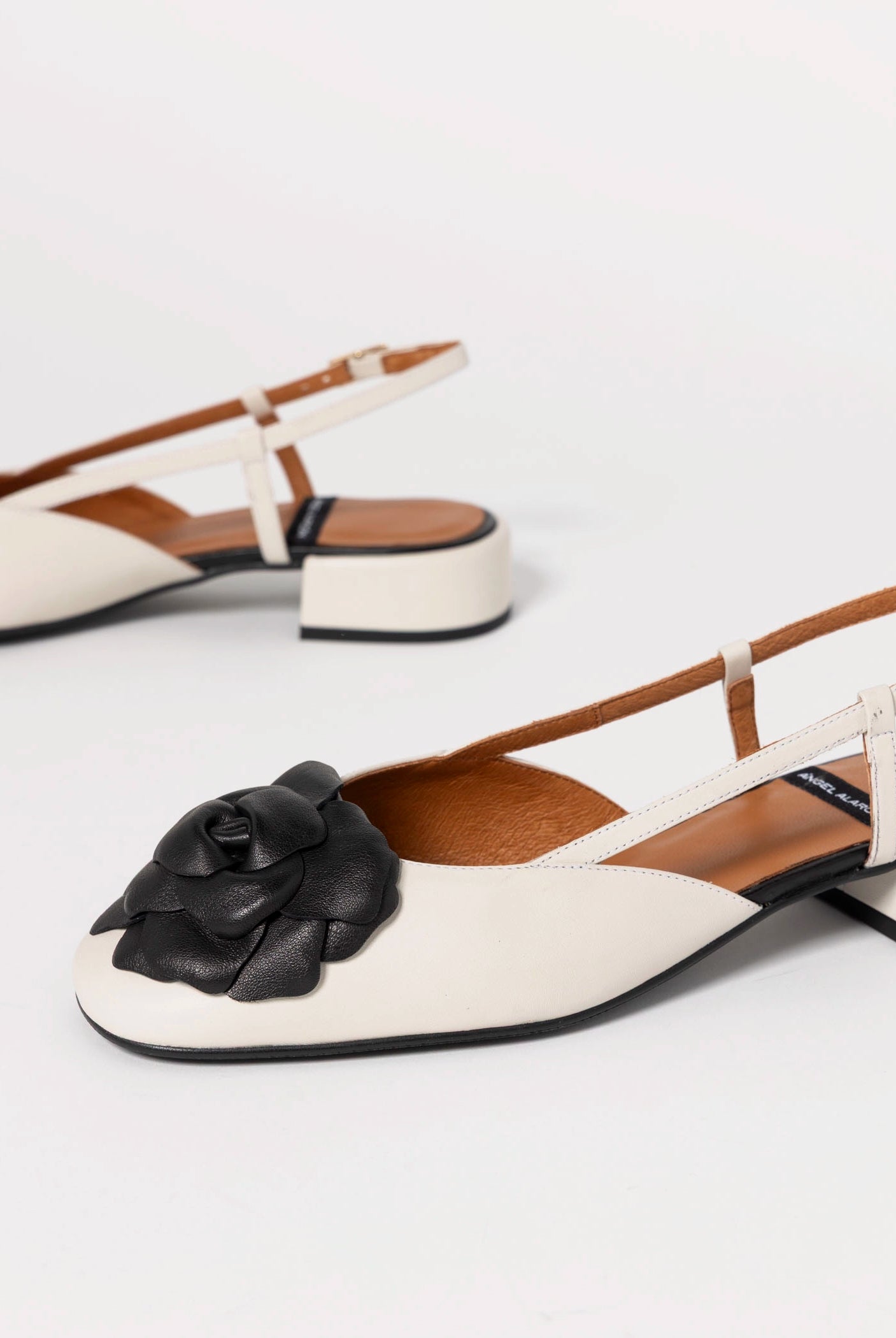 swatch_Ivory/Black florence leather slingback angel alarcon
