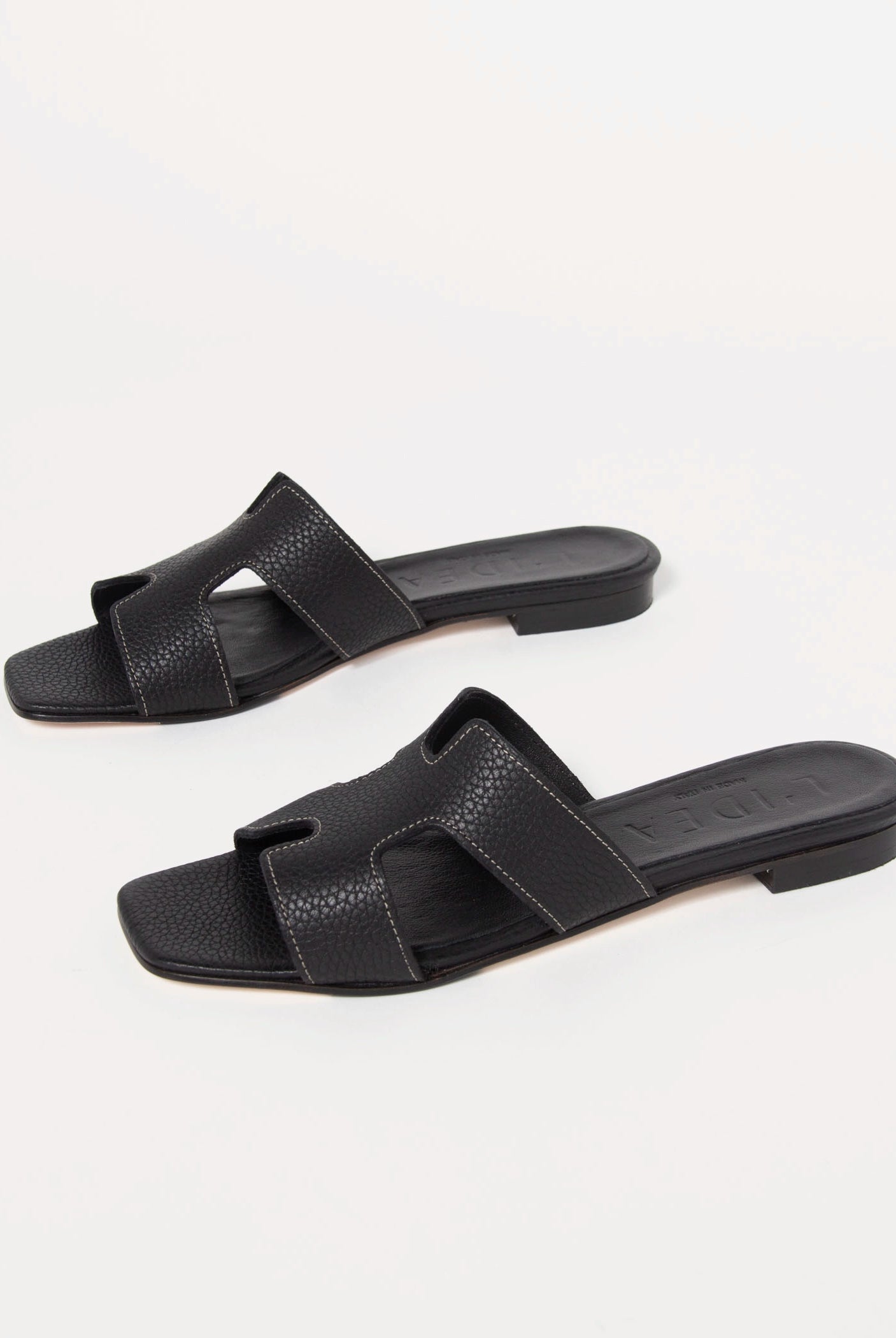 swatch_black leather leather cutout sandal flat sandals