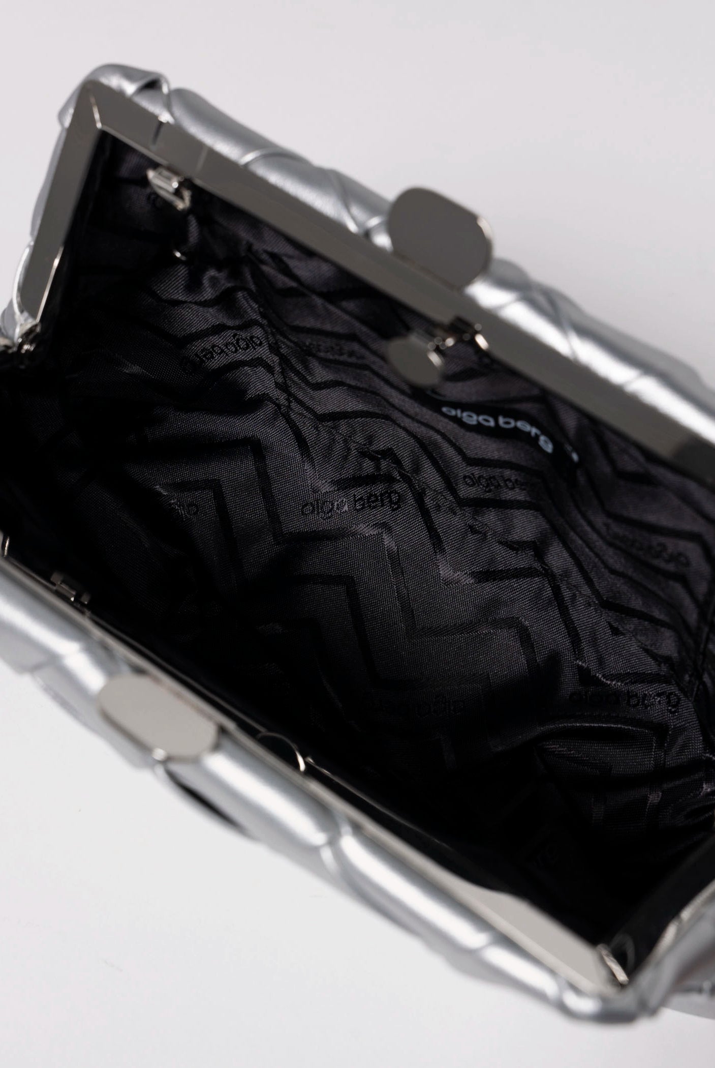 swatch_Silver olga berg quinn woven leather clutch