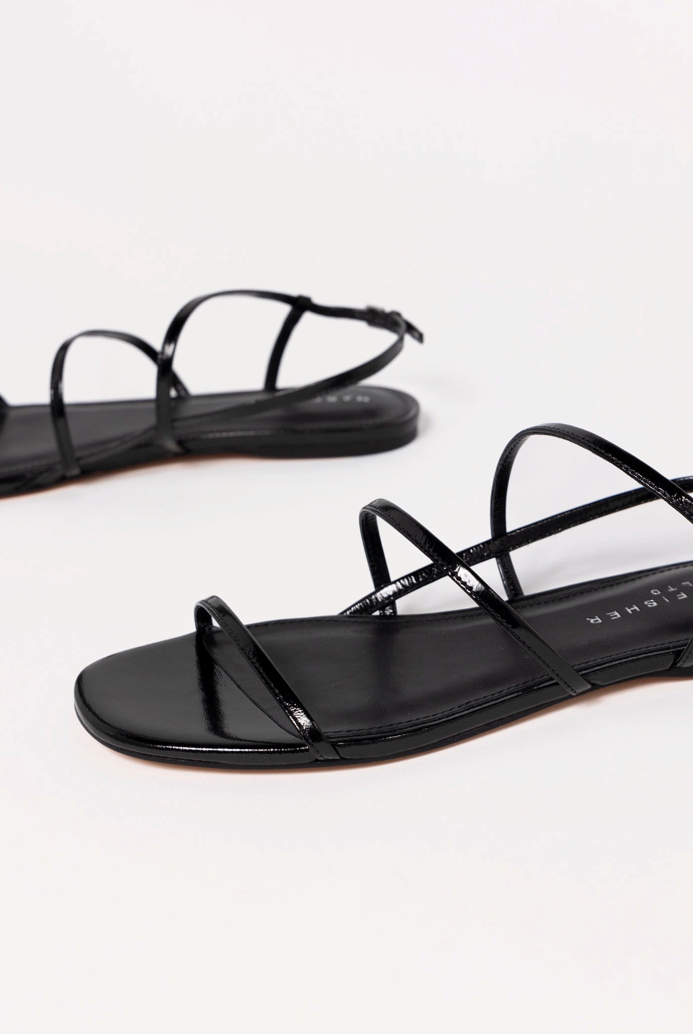 swatch_Black Leather marc fisher elysha flat sandal