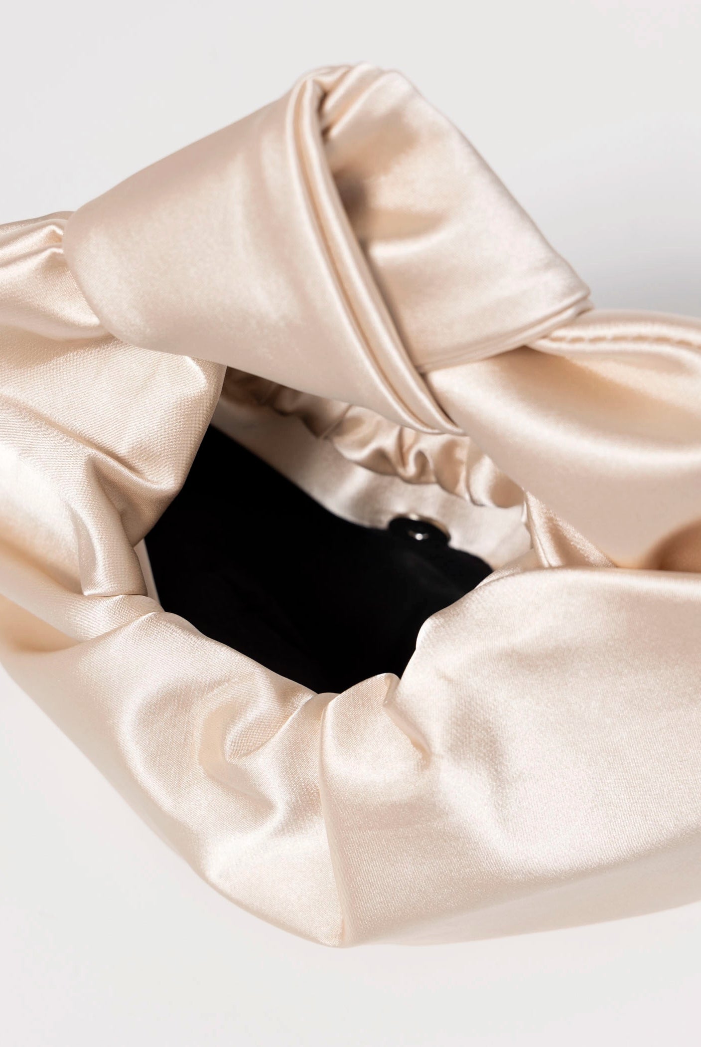 swatch_Champagne satin knot evening bag