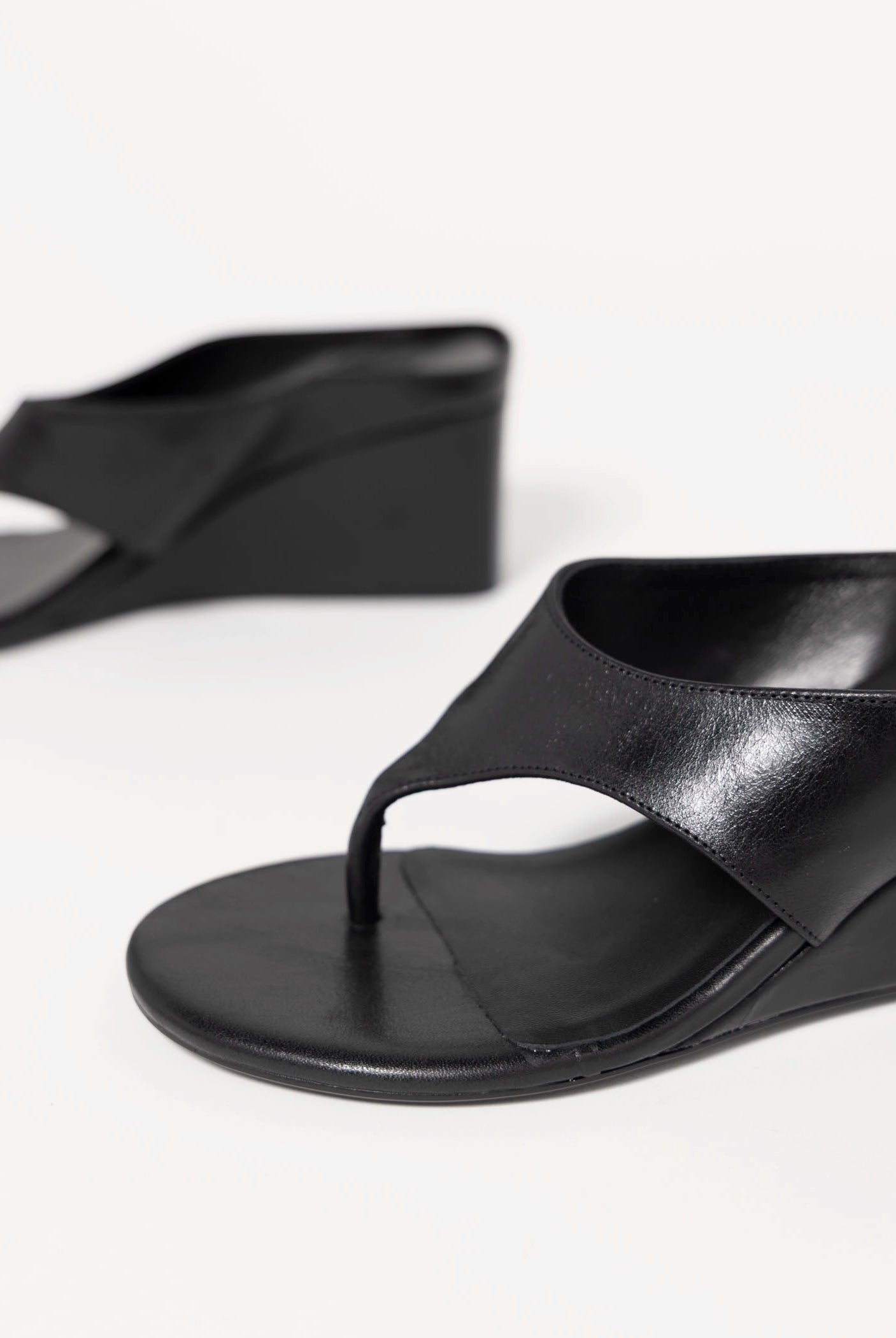 swatch_Black Leather tony bianco swift thong wedge sandal