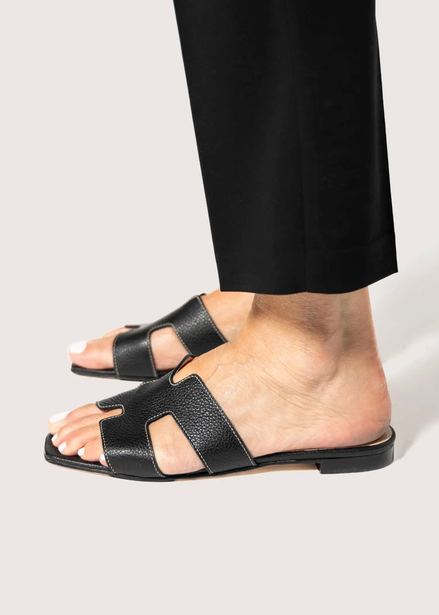 swatch_black leather leather cutout sandal flat sandals