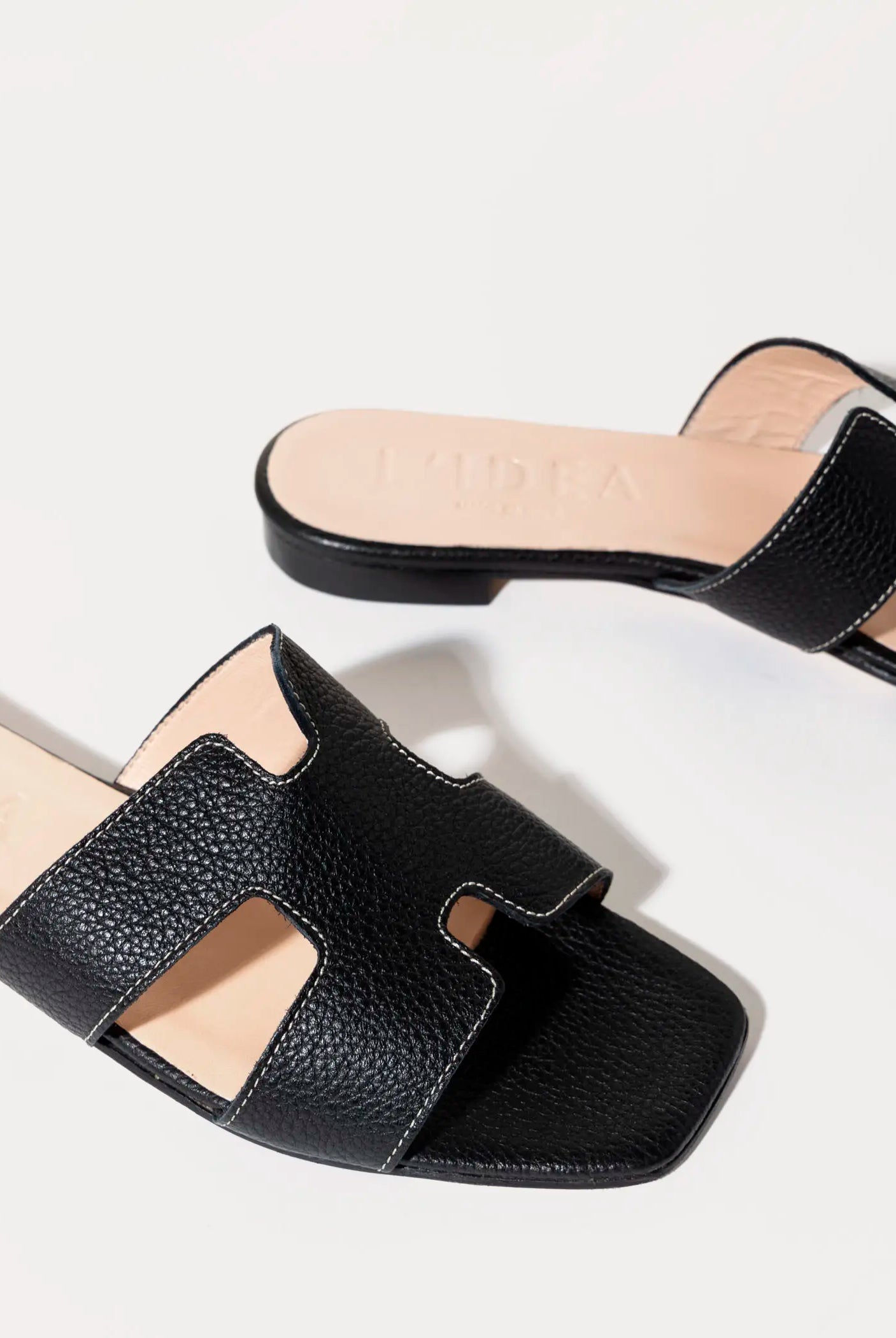 swatch_black leather leather cutout sandal flat sandals