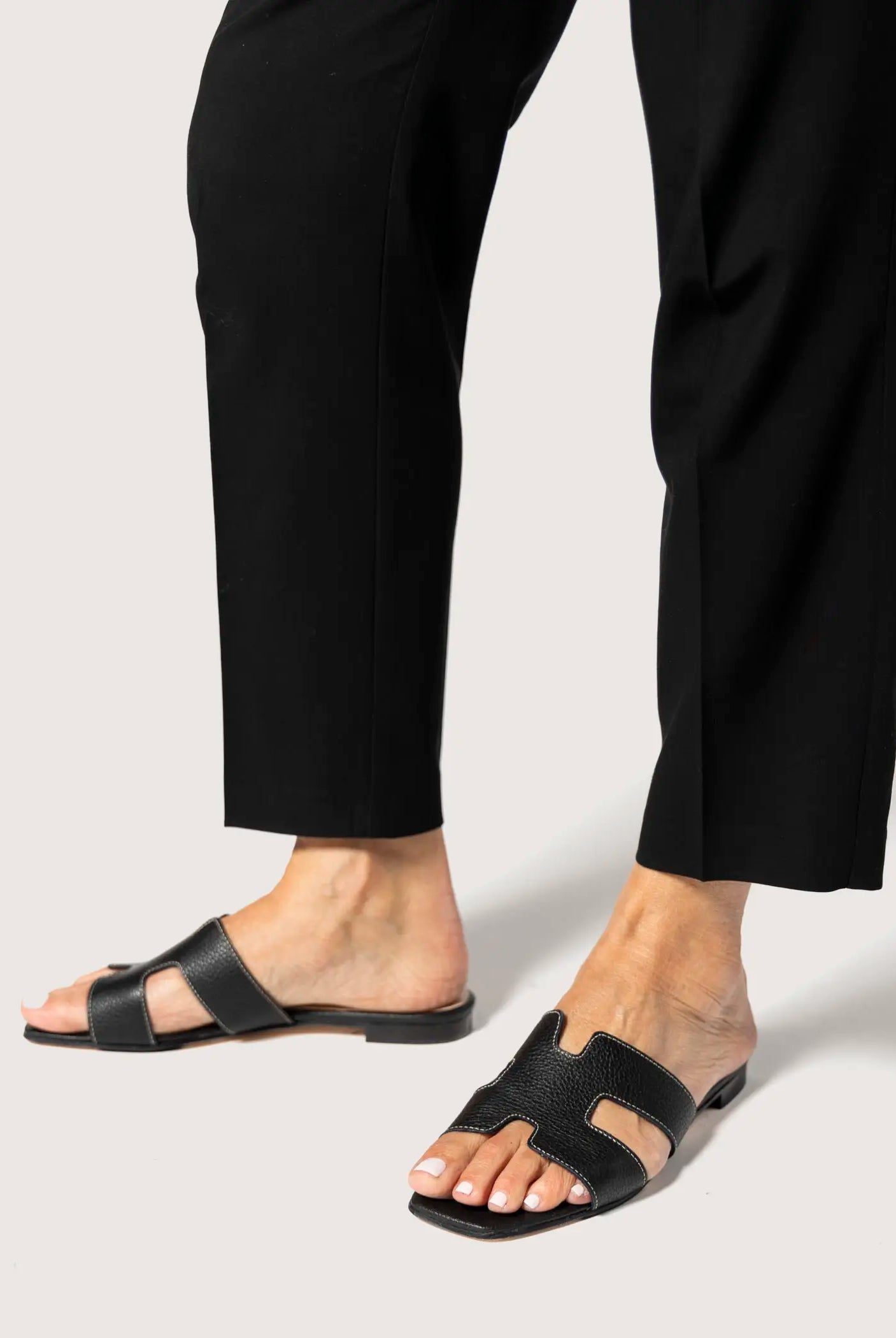 swatch_black leather leather cutout sandal flat sandals