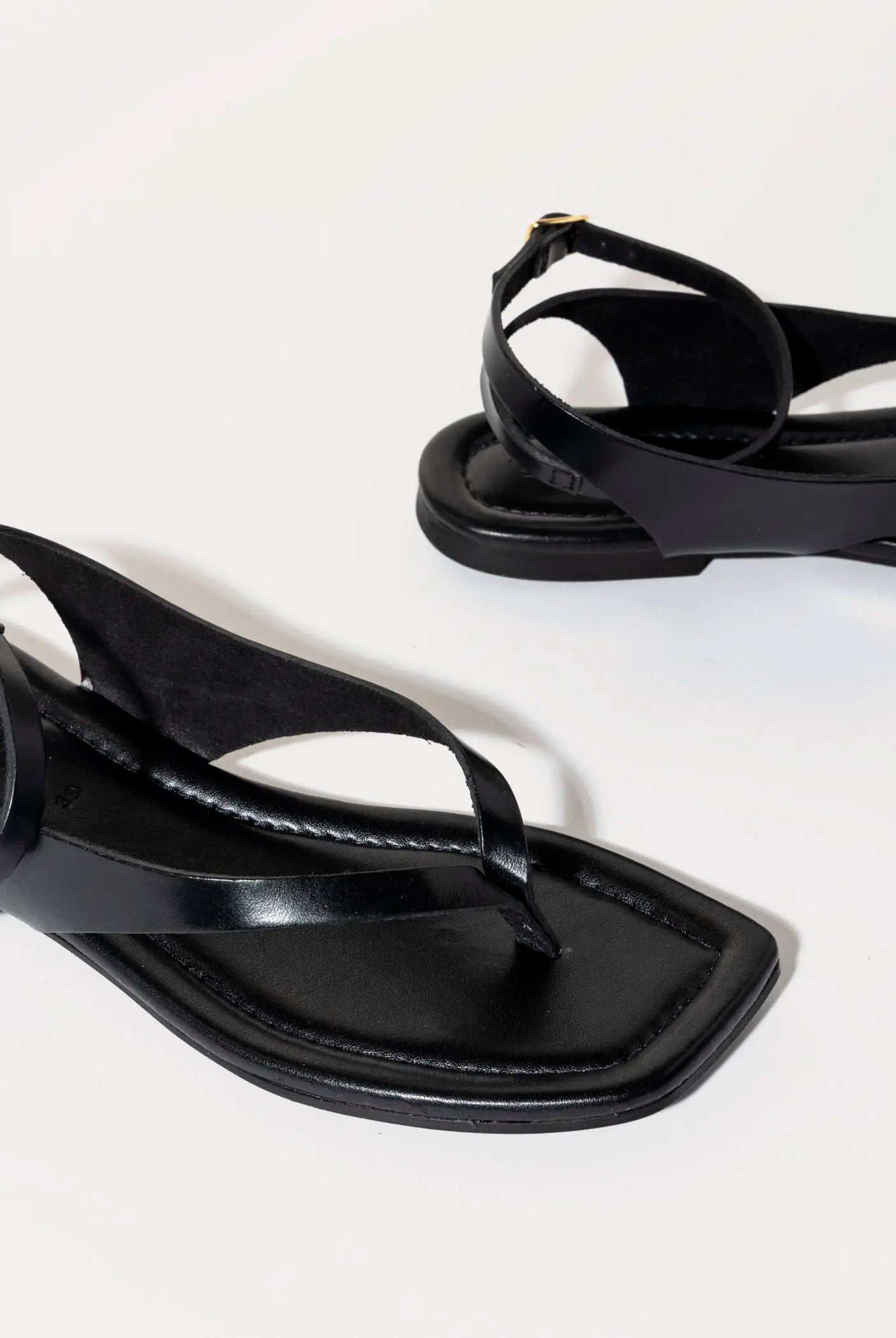 swatch_black leather flat thong sandal flat sandals