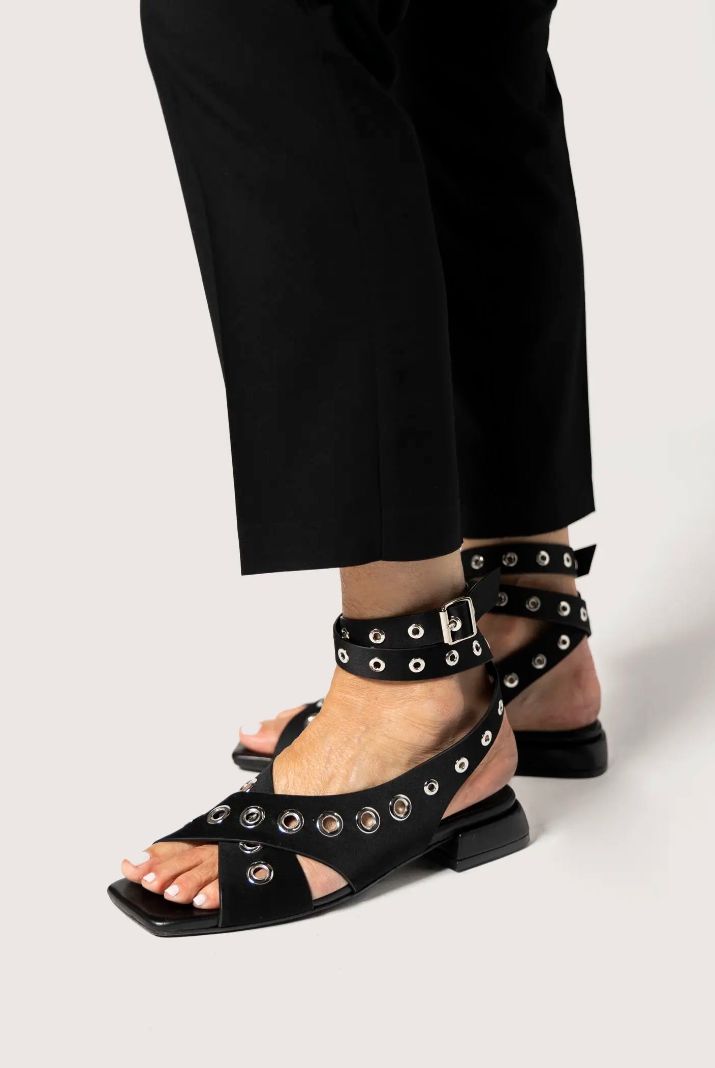 swatch_black satin flat sandal with grommets flat sandals