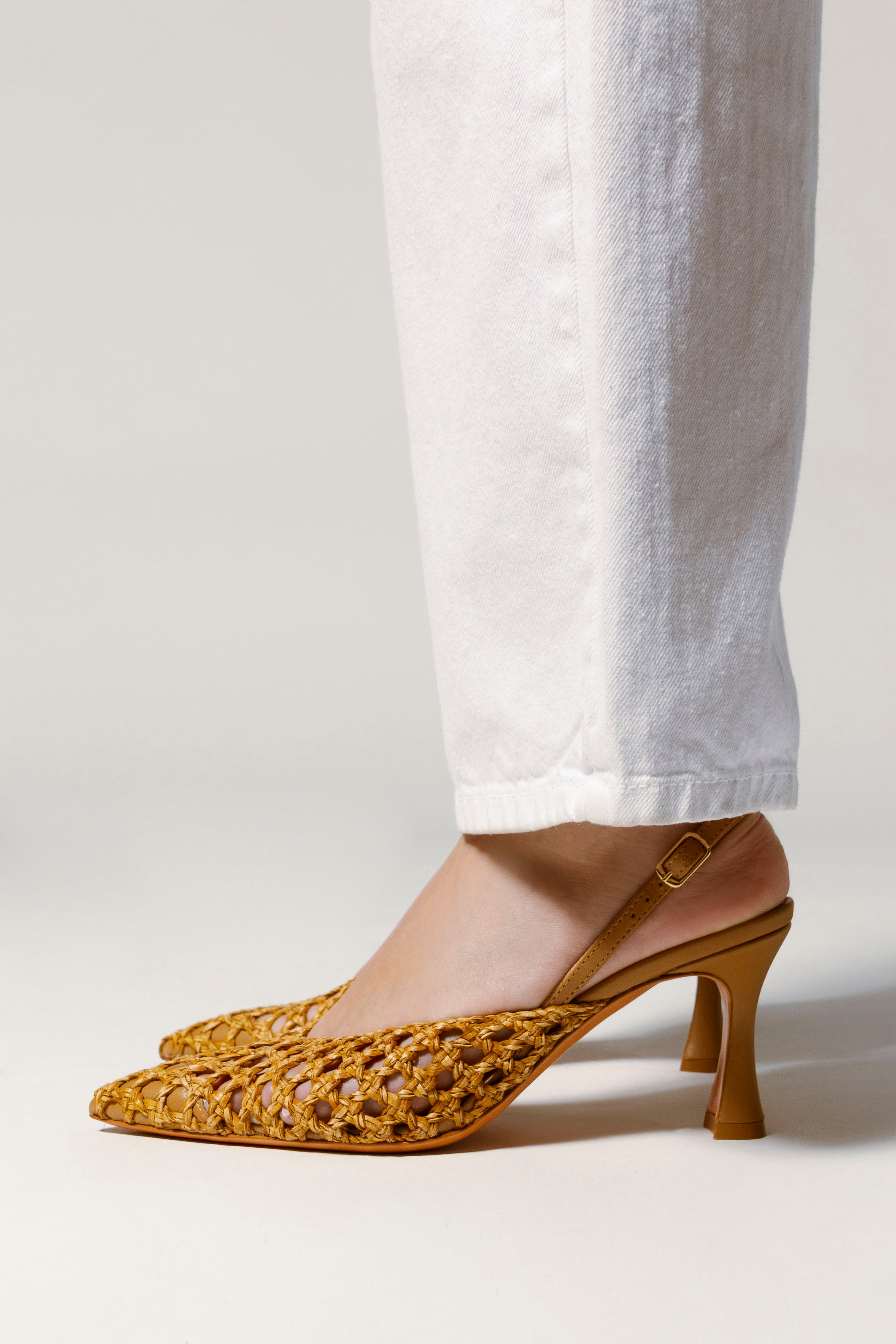 image of woven leather heels with a link to shop all heels