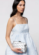 swatch_Silver olga berg quinn woven leather clutch