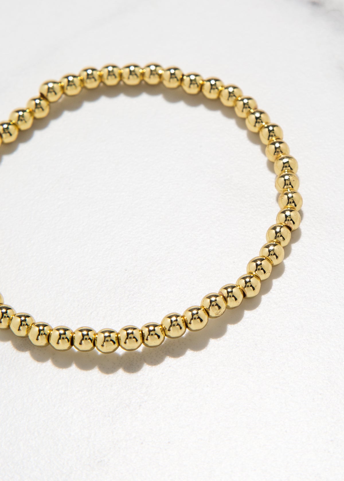 swatch_gold small beaded stretch bracelet accessories