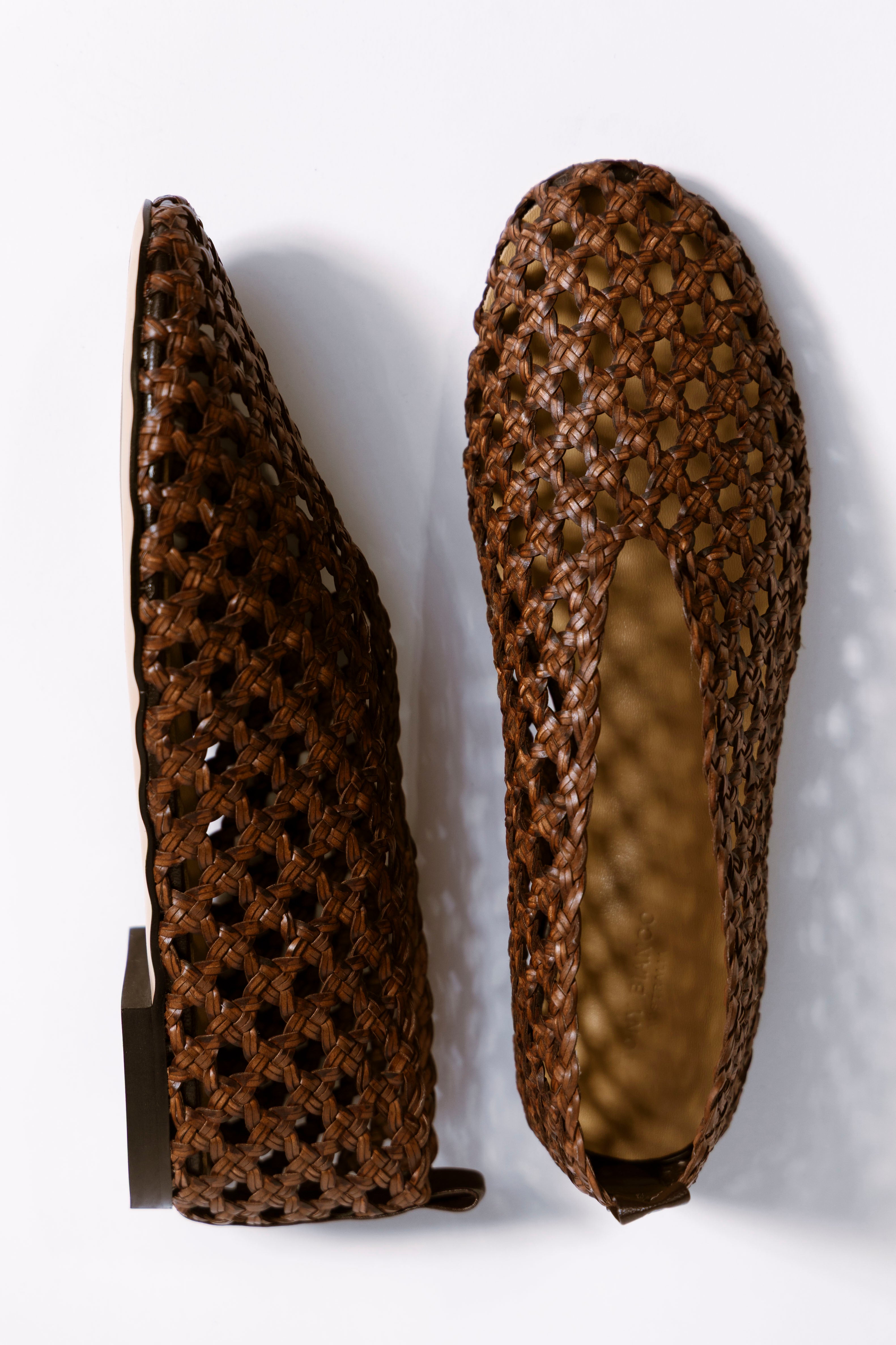 image of brown woven leather flats with link to shop tony bianco collection