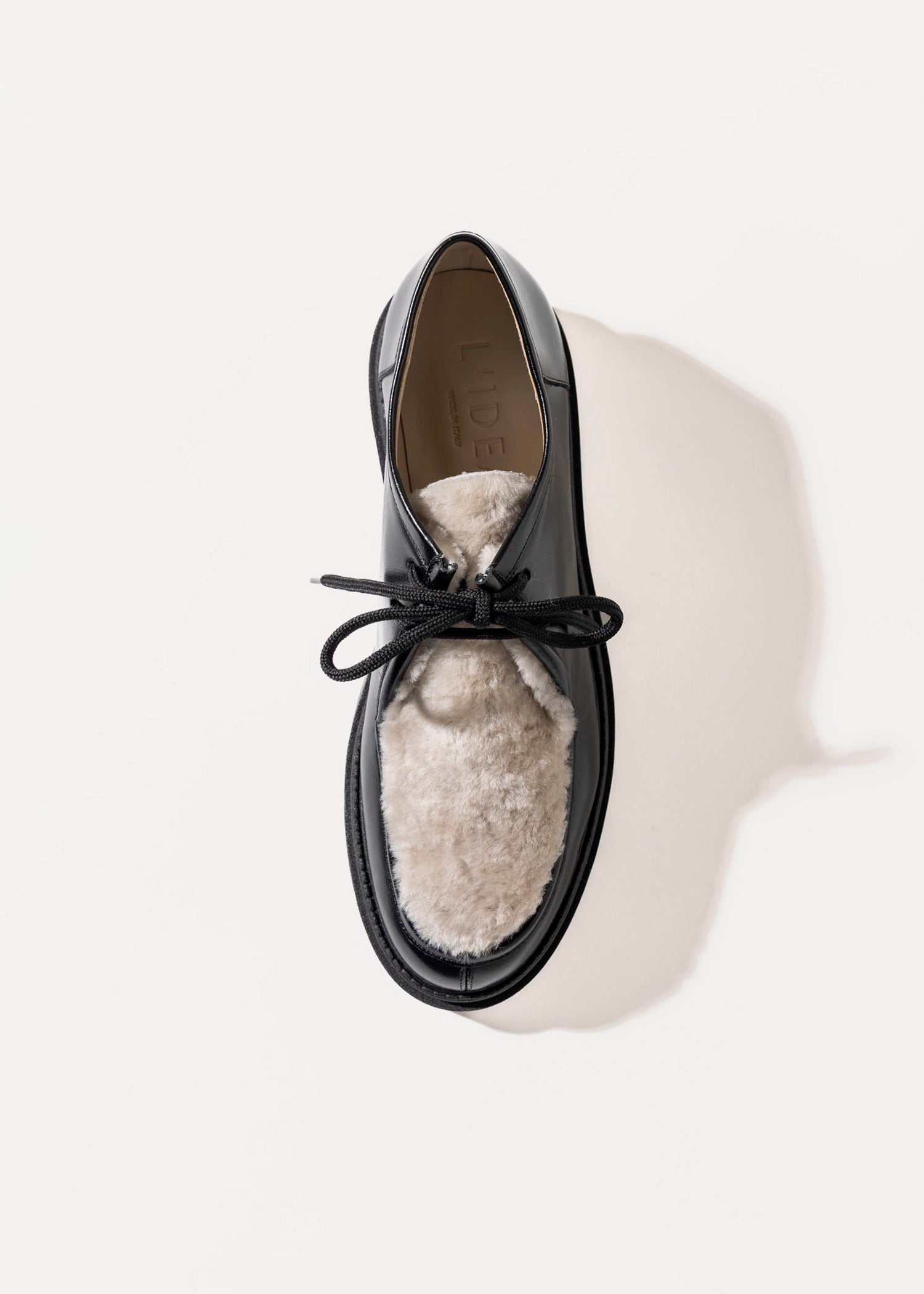 swatch_Black Leather shearling wallabe