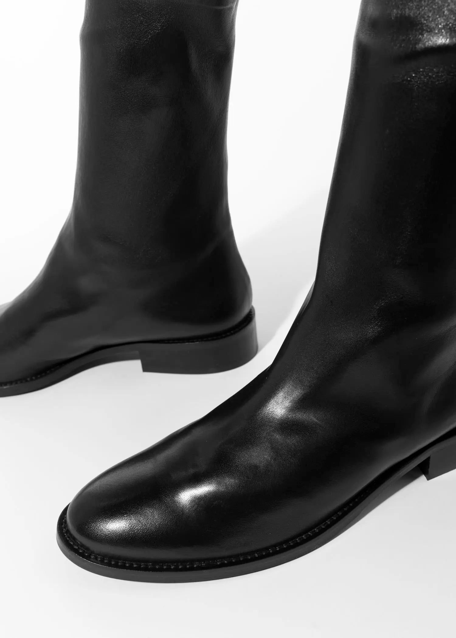 swatch_Black Leather pull on leather bootie shoes