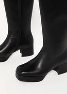 swatch_Black capacity knee high boot