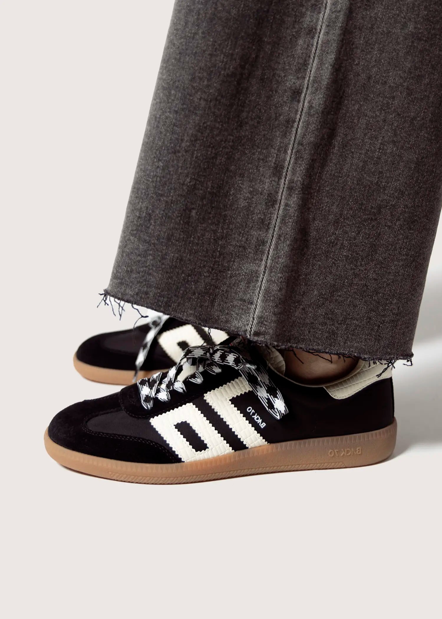 swatch_Black ghost sneakers