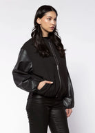 swatch_Black faux leather bubble bomber jackets