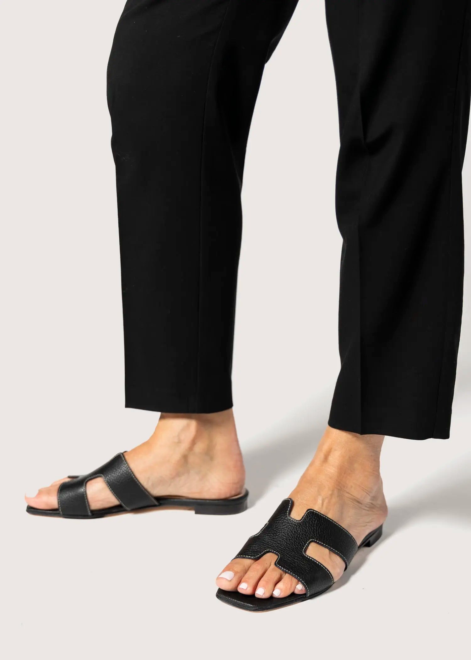 swatch_black leather leather cutout sandal flat sandals