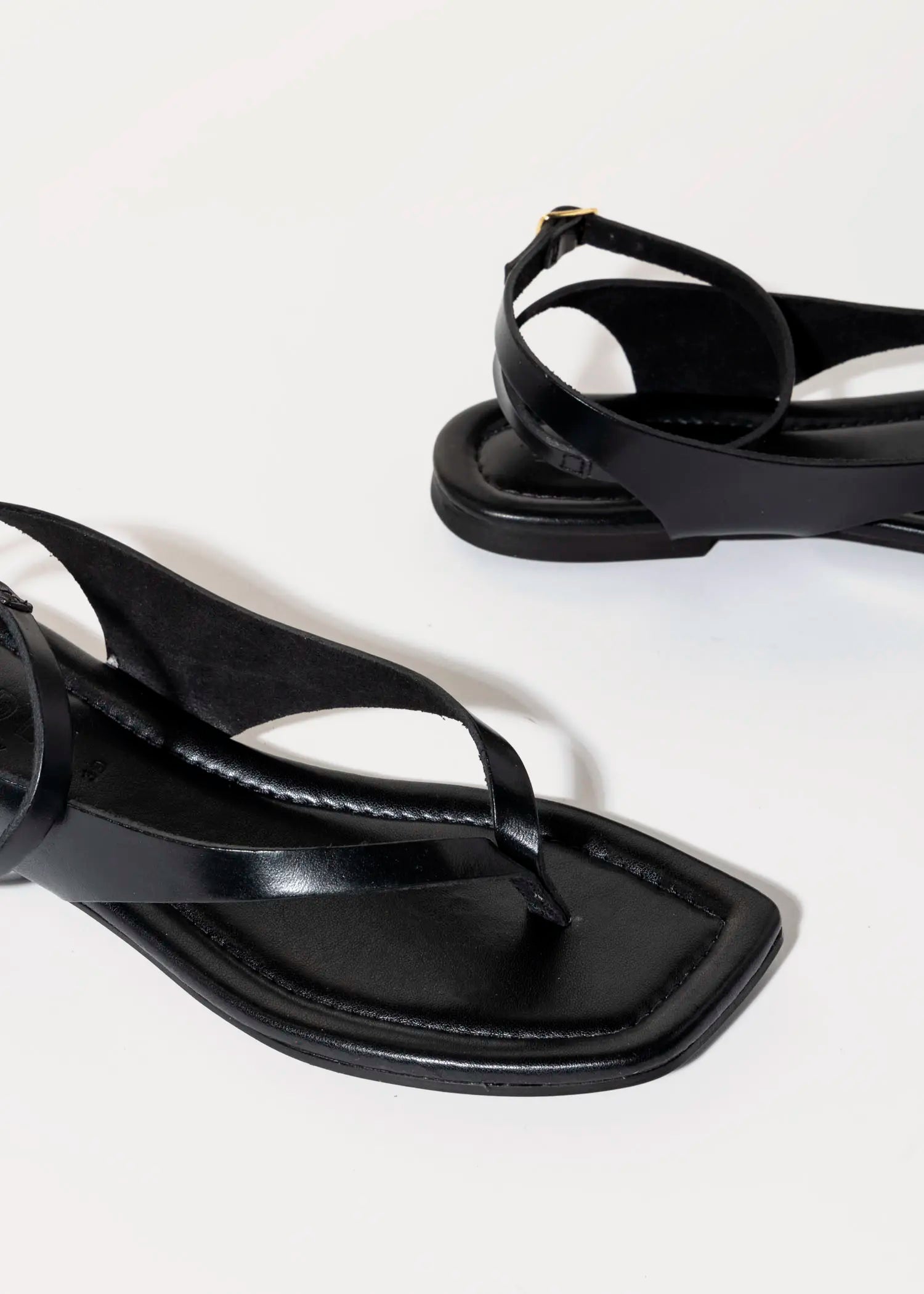 swatch_black leather flat thong sandal flat sandals