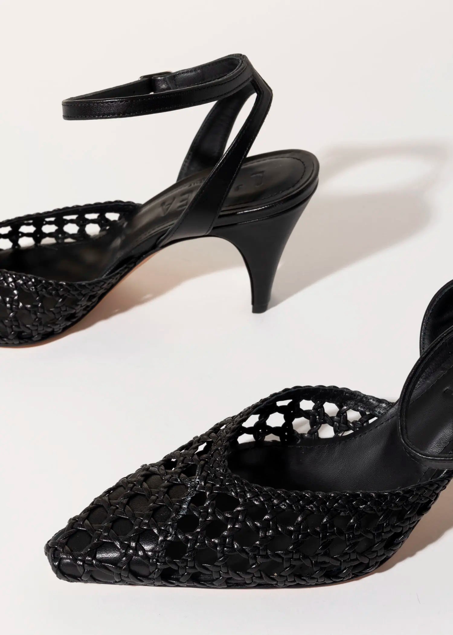 swatch_black leather livia two piece woven pump heels